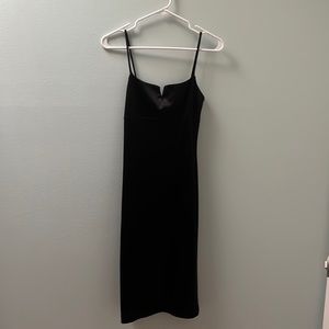 Black spaghetti strap dress with small slit in the back